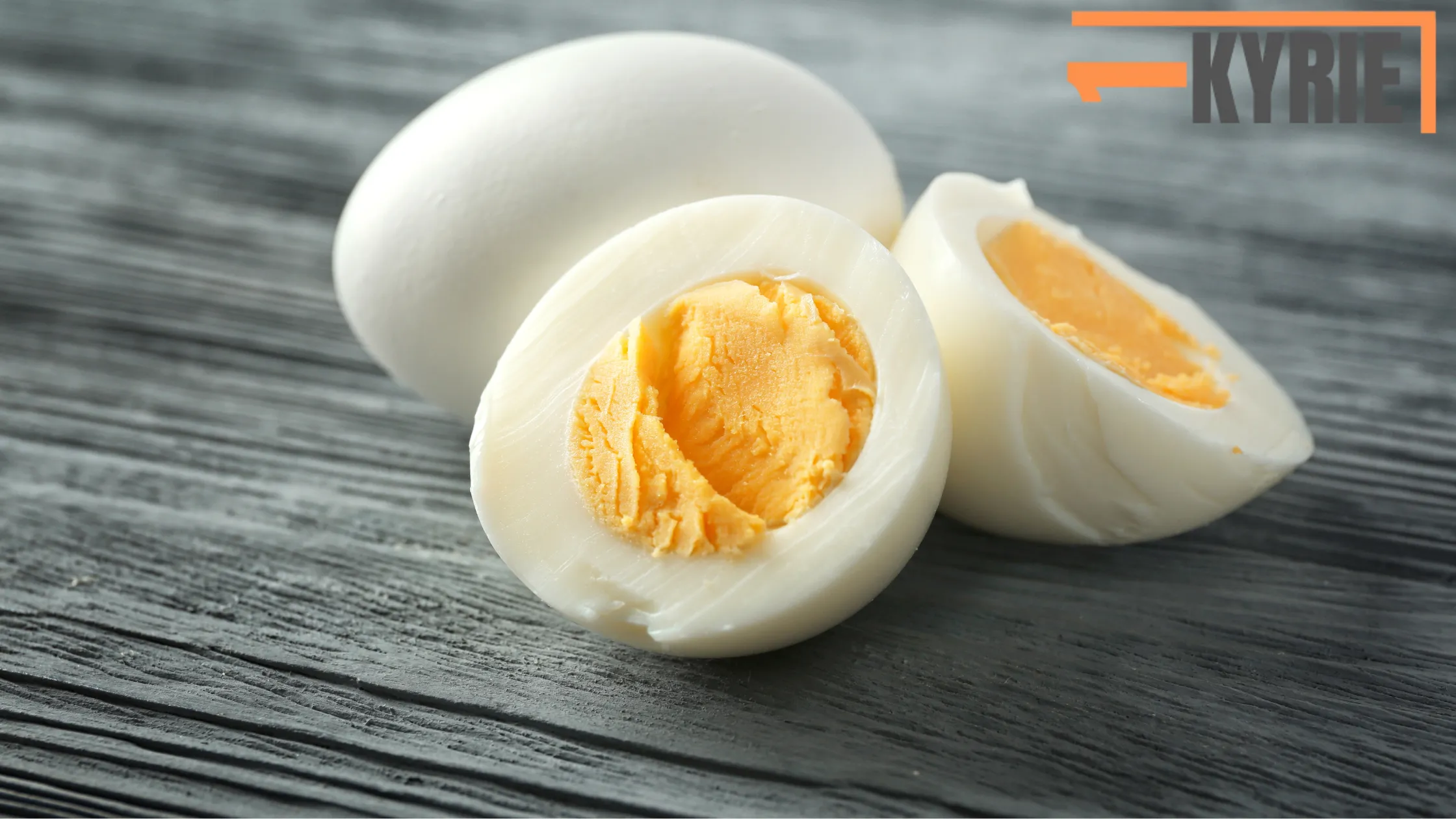 The image shows halved boiled eggs. The answer to "Can you freeze boiled eggs?" is yes, but only the yolks freeze well. Freezing egg whites may result in a rubbery texture.