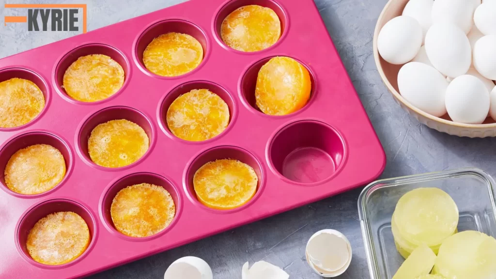 In the image, boiled egg yolks are being frozen in a silicone tray. The answer to the question "Can you freeze boiled eggs?" is yes, but it's best to freeze just the yolks, as the whites can become rubbery when frozen.